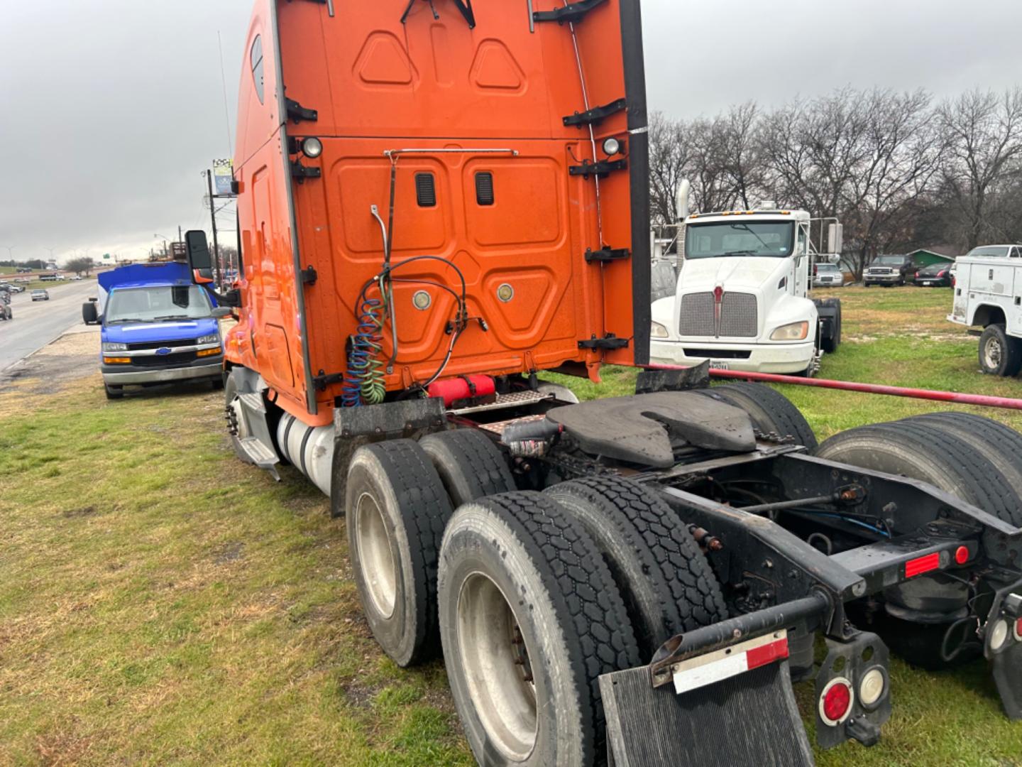 2013 Orange Freightliner Cascadia 125 (3AKJGLDR0DS) , located at 1687 Business 35 S, New Braunfels, TX, 78130, (830) 625-7159, 29.655487, -98.051491 - Photo#2